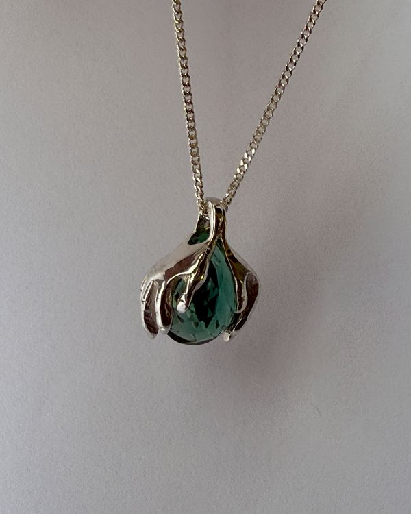 Rona pendant, close detail of the silver hands and green quartz