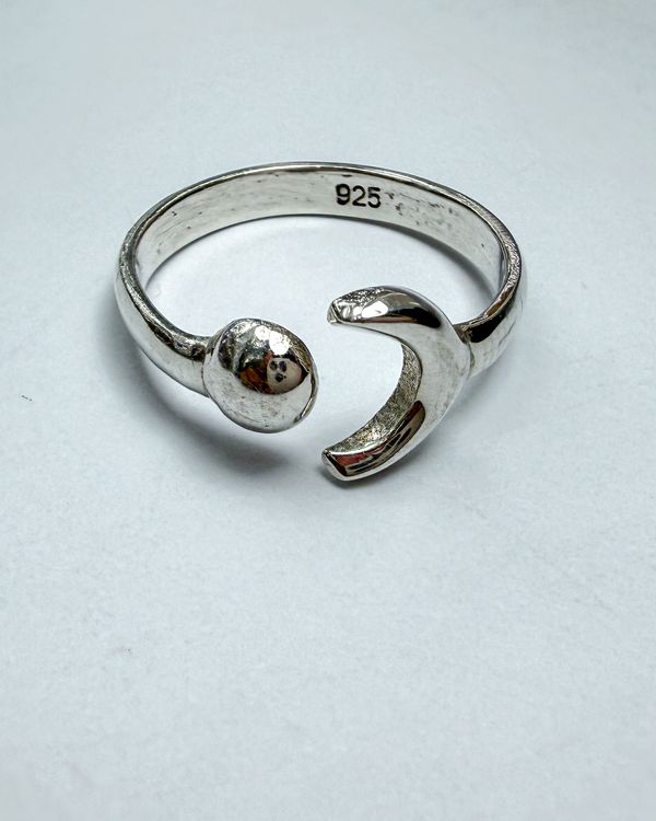 Gerhana ring in sterling silver, a crescent moon and a small full moon on an open band