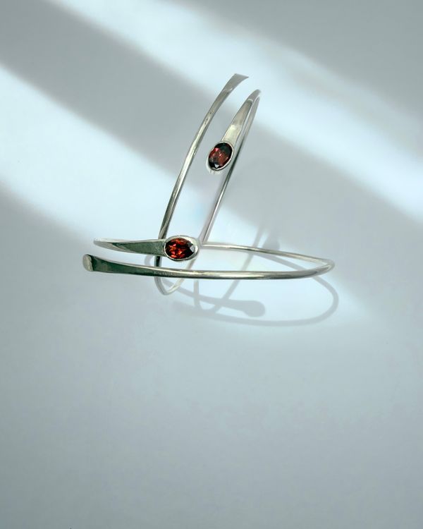 Mandala bracelet: a sterling silver spiral set with garnet